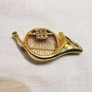 Vintage Monet Goldtone French Horn Brooch with cubic zirconias